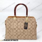 کیف زنانه بزرگ دسته شیشه ای طرح کوچ COACH کرم های‌کپی (High Copy)